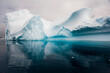 © Designpics - Abstract shape of an iceberg with blue ice shadows and dark, turquoise water of the Southern Ocean at Cierva Cove in Hughes Bay; Antarctic Peninsula, Antarctica