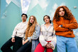 © EFStock - Portrait group of young Gen Z friends standing with serious expression in the city