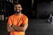 © Wavebreak Media - Portrait of bearded biracial young man with arms crossed smiling and standing in gym
