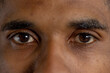 © Wavebreak Media - Closeup portrait of biracial young man staring with brown eyes in gym