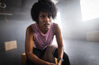 © Wavebreak Media - Closeup of exhausted biracial young woman with short hair sitting on box and relaxing in gym