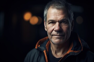 Poster - Portrait of a senior man in a dark room with lights.