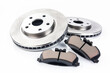 Car brake disc and pads on white background