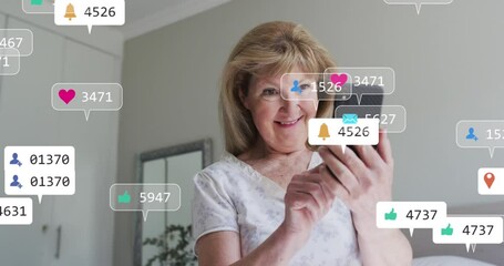 Poster - Animation of social media icons against caucasian senior woman using smartphone at home