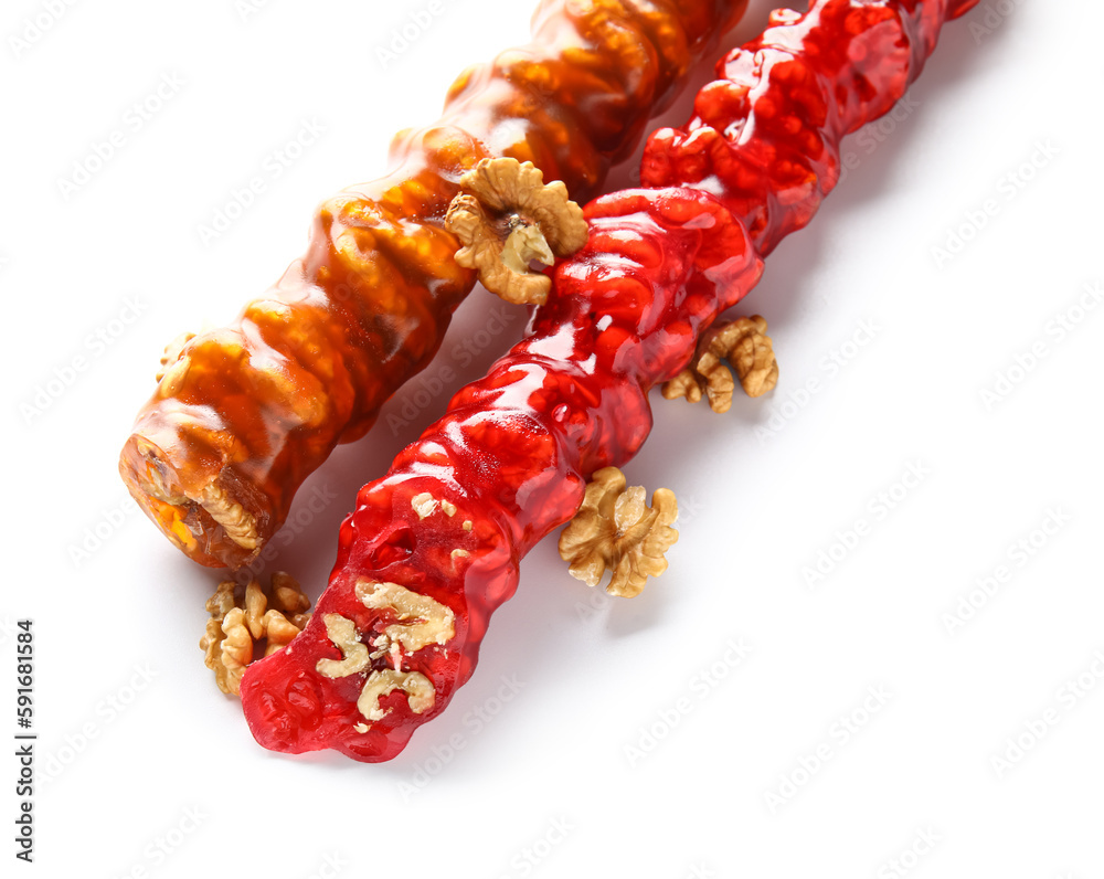 Delicious churchkhela and walnuts isolated on white background