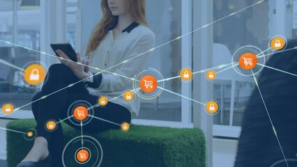 Poster - Animation of network of connections with icons over caucasian businesswoman using tablet at office