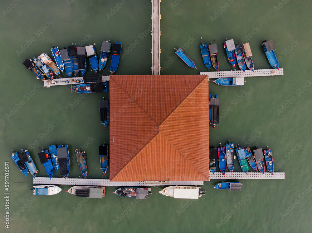 Aerial top down view of various fishing boat park at the dock with ...