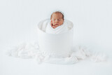 Fototapeta  - Newborn baby girl in studio