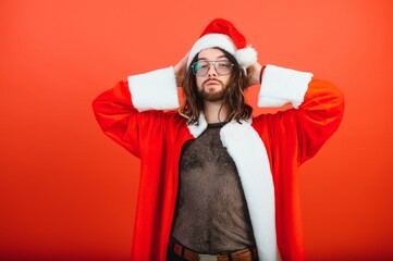 New Year's LGBT party. A gay man in a Santa suit. Concept of Equality.