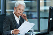 © View Stock - Older men work in business