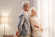 © View Stock - Elderly people in front of the window give gifts to their wives