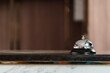 © mojo_cp - Luxury Hotel Reception Counter desk with Silver Service bell, Сheck in hotel.