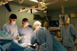 © Georgii - faces of surgeons in the operating room during the operation. Modern medicine, medical workers during a complex operation, modern medicine