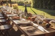 A rustic and elegant wine tasting event set in a picturesque vineyard, with a long wooden table adorned with various wine glasses, bottles of wine, charcuterie boards, and fresh grapes