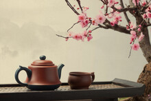 Teapot On Peach Blossom Background