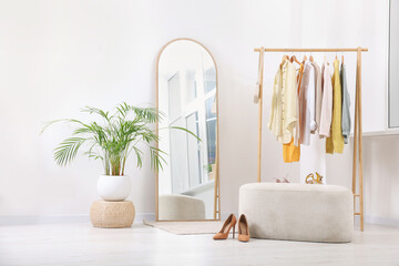 Aufkleber - Stylish dressing room interior with mirror, ottoman and clothing rack