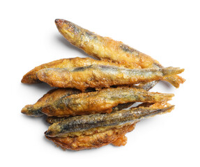 Pile of delicious fried anchovies on white background, top view