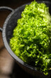 Fresh lettuce on brown table, closeup. Salad greens
