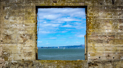 Canvas Print - Scenic view of the calm sea seen from the window of an old building