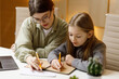 © Andrii Zastrozhnov - A young woman teacher conducts a private lesson with a little girl, a child psychologist.