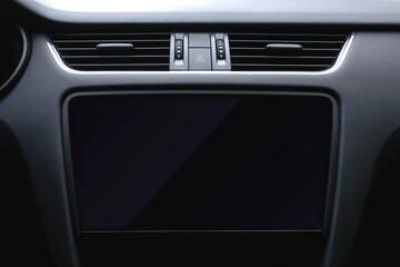 Dashboard of a modern car with a large black display. Car interior detail. Car lcd display template.