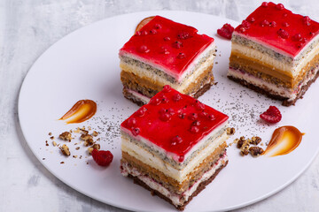 Canvas Print - Appetizing dessert with slices of cakes with raspberry and nuts