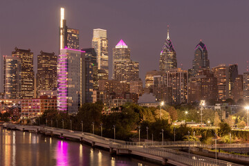 Sticker - Philadelphia Downtown skyline at Night with the Schuylkill river. Beautiful Sunset Light. Schuylkill River Trail in Background. City skyline glows under the beautiful sunset light. Cityscape. PA, USA.