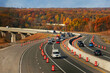 The Ohio Turnpike curves through a construction area in the Cuyahoga Valley of Northeast Ohio amid autumn colors