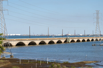  The old Galveston Causeway is shown, Galveston,  Texas, USA. The old Galveston Causeway was built in 1912 and listed on the National Register of Historic Place