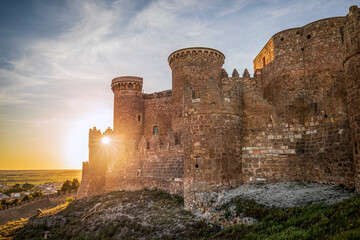 Poster - View of the impressive medieval fortress and castle of Belmonte in Cuenca, Spain at sunset and backlit