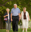 © Designpics - Three seniors walking together in a park; Edmonton, alberta, canada