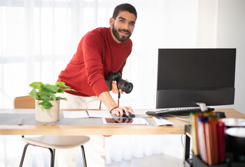 Wall Mural - Professional photographer working on photo shoot at studio