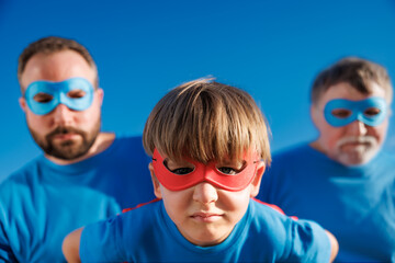 Wall Mural - Grandfather, father and son having fun outdoor. Fathers day