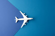 Close up of white airplane model on blue background with copy space