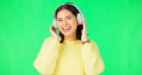 Canvas Print - Face, green screen and woman with headphones, listen and movement on a studio background. Portrait, female dancer and person with headset, streaming music and excitement with stress relief and relax