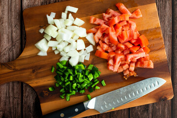 Canvas Print - Chopped Onion, Tomato, and Green Chili Pepper on a Wood Cutting Board: Prepped fresh vegetables on a wooden chopping board with a kitchen knife