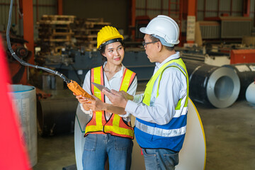 Professional industry engineer worker in a metal manufacture warehouse , maintenance service check for safety first concept .