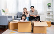 © paulaphoto - Asian family father mother daughter girl packing cardboard box moving, online marketing e-commerce unpacking stuff belongings home delivery. Lifestyle happy asian family together relocation concept.