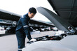 © Deemerwha studio - Automobile mechanic repairman checking a car engine by inspecting and writing to the clipboard the checklist for repair machine and car service for maintenance and maintenance check concept.
