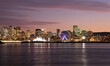 Montreal skyline at night reflected in St. Lawrence River, Quebec, Canada