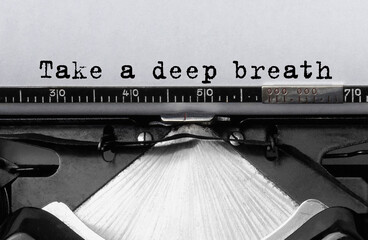 Poster - text take a deep breath typed on retro typewriter