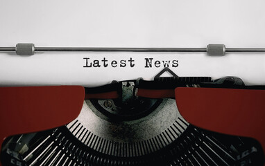 Poster - Text Latest News typed on retro typewriter