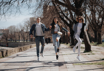 Three friends running and jumping