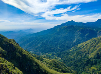 Wall Mural - Beautiful mountain tropical landscape with green hills and blue sky. Photography for tourism background, design and advertising.