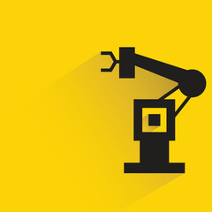 Wall Mural - industrial robotic arm with shadow on yellow background