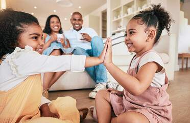 Wall Mural - Family, high five and children playing, smile and having fun in a living room. Kids, hands and games with parents bonding in their home, cheerful and relaxing, smiling and enjoying happy childhood