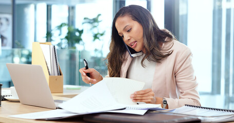 Poster - Female advertising agent looking busy while talking on a phone call and searching through documents on a messy table in an office. Female marketing professional trying to find an important form