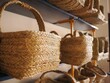 Closeup of woven baskets arranged on the shelves.