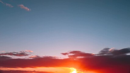 Wall Mural - Cumulus Sky Time-lapse 4k. Clouds Move Quickly Across The Sky. Flight Of Fancy. Morning Sunrise. Sunlight Shining Through Clouds. Sunrays, Sunray, Ray, Dramatic Sky. Sunrise Sky Natural Background