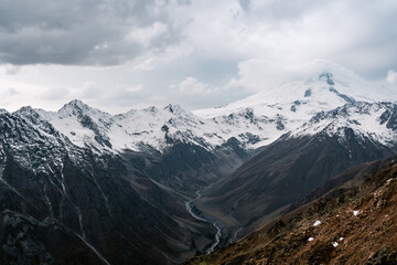 Wall Mural - View of the valley and Mount Elbrus in the cloud